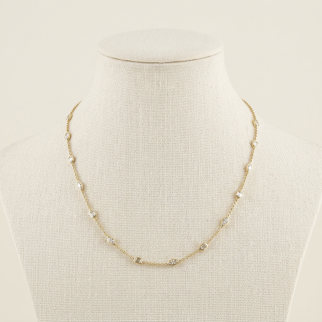 THE STATION NECKLACE IN MARQUISE AND EMERALDS