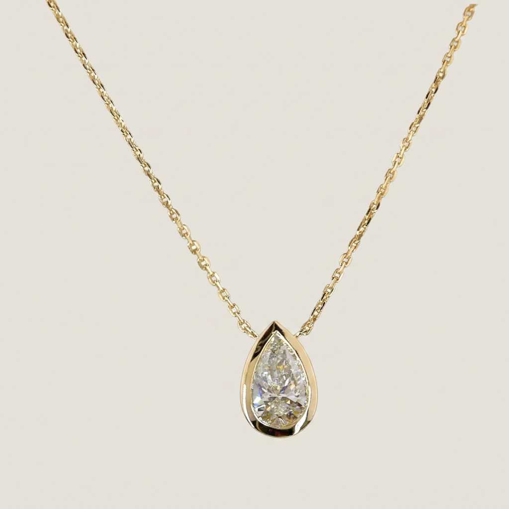 1.00 CTW BEZEL PEAR PENDANT