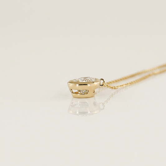 1.00 CTW BEZEL PEAR PENDANT